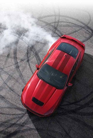 Overhead view of a 2024 Ford Mustang® model with tire tracks on pavement | Essential Ford of Stuart in Stuart FL